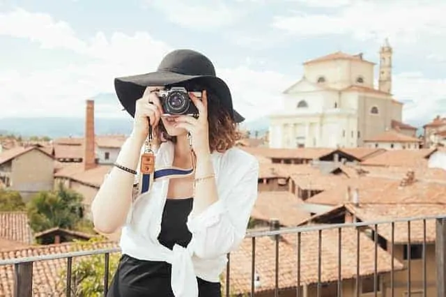 woman taking photo while traveling