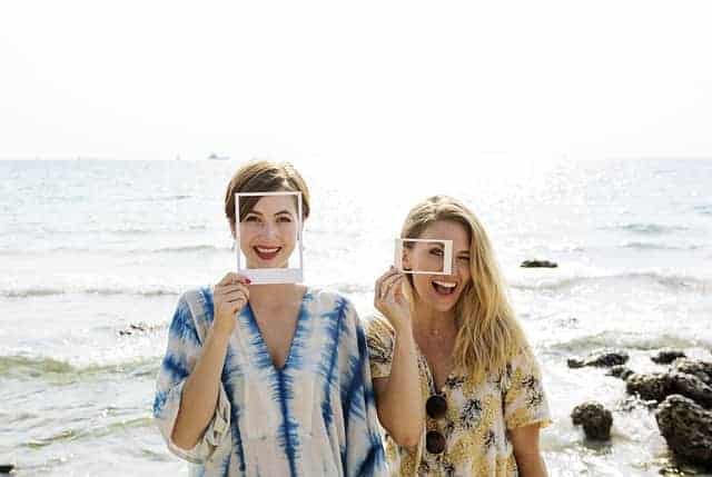 women laughing on beach