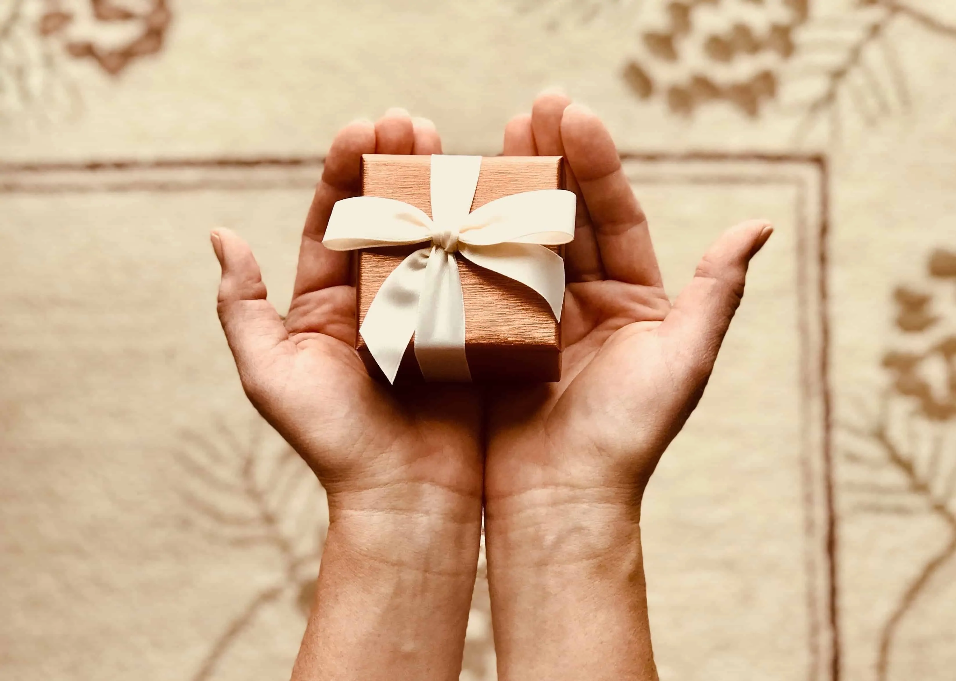 person-holding-gift-box